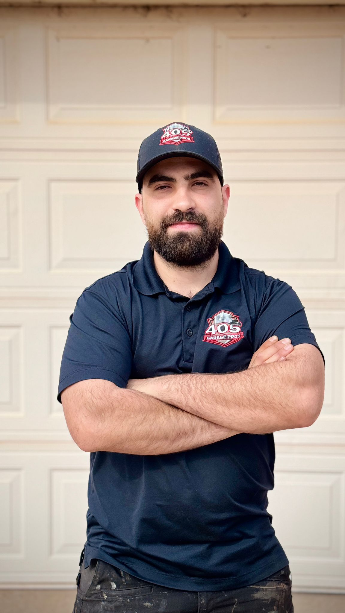 405 Garage Pros technician standing by service truck