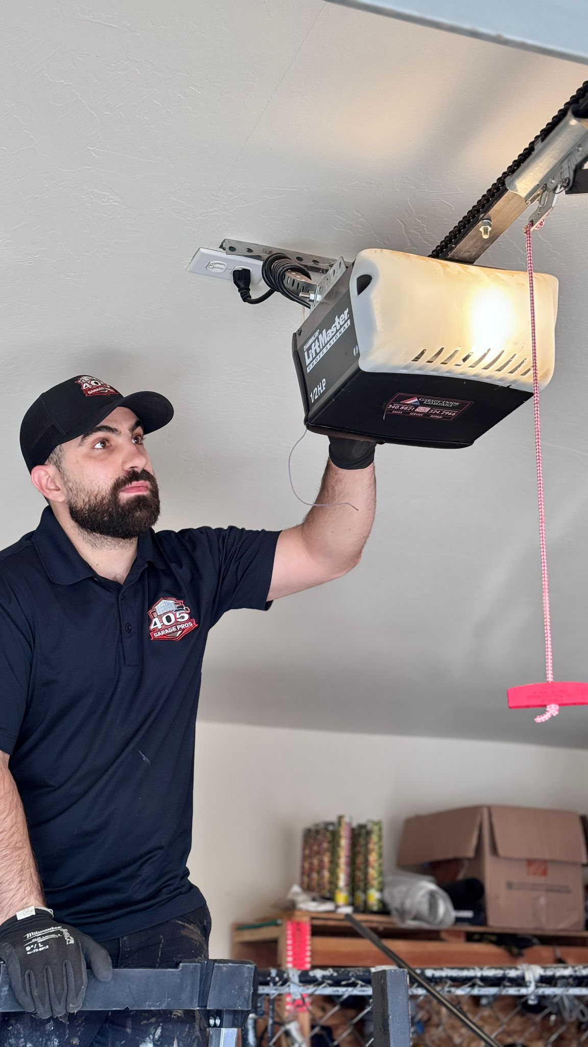 405 Garage Pros technician installing a garage door opener